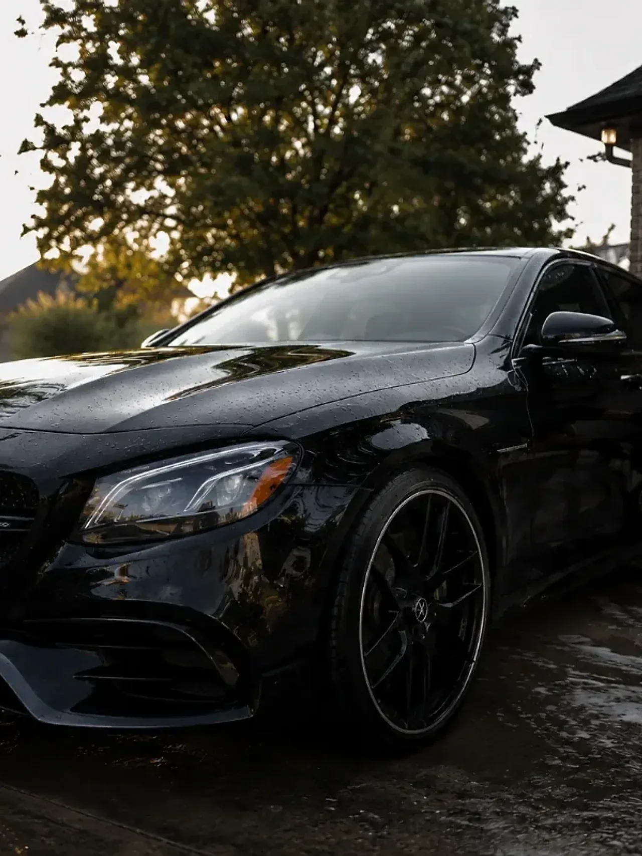 Mobile car detailing van and sedan in a Fort Worth driveway during a full service