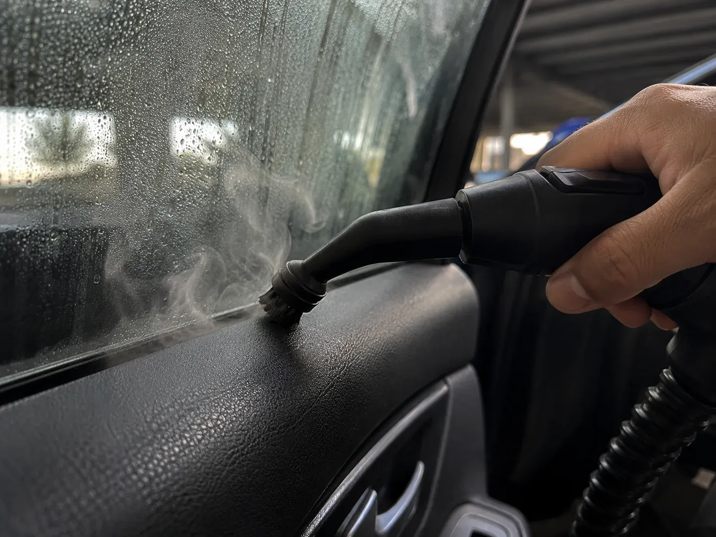 Steam cleaning vents and seams inside a car in Irving
